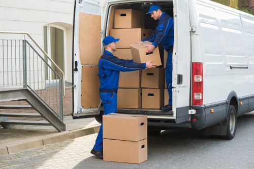 Loading boxes and furniture into a hired removal truck for local transport in Bermondsey
