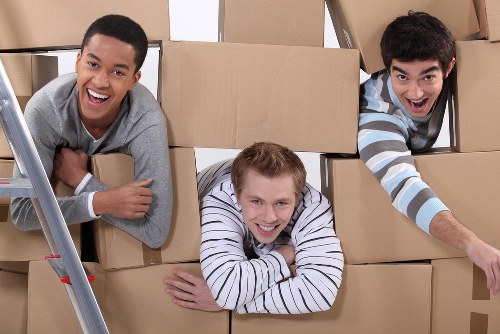 Local moving team handling boxes in Bermondsey